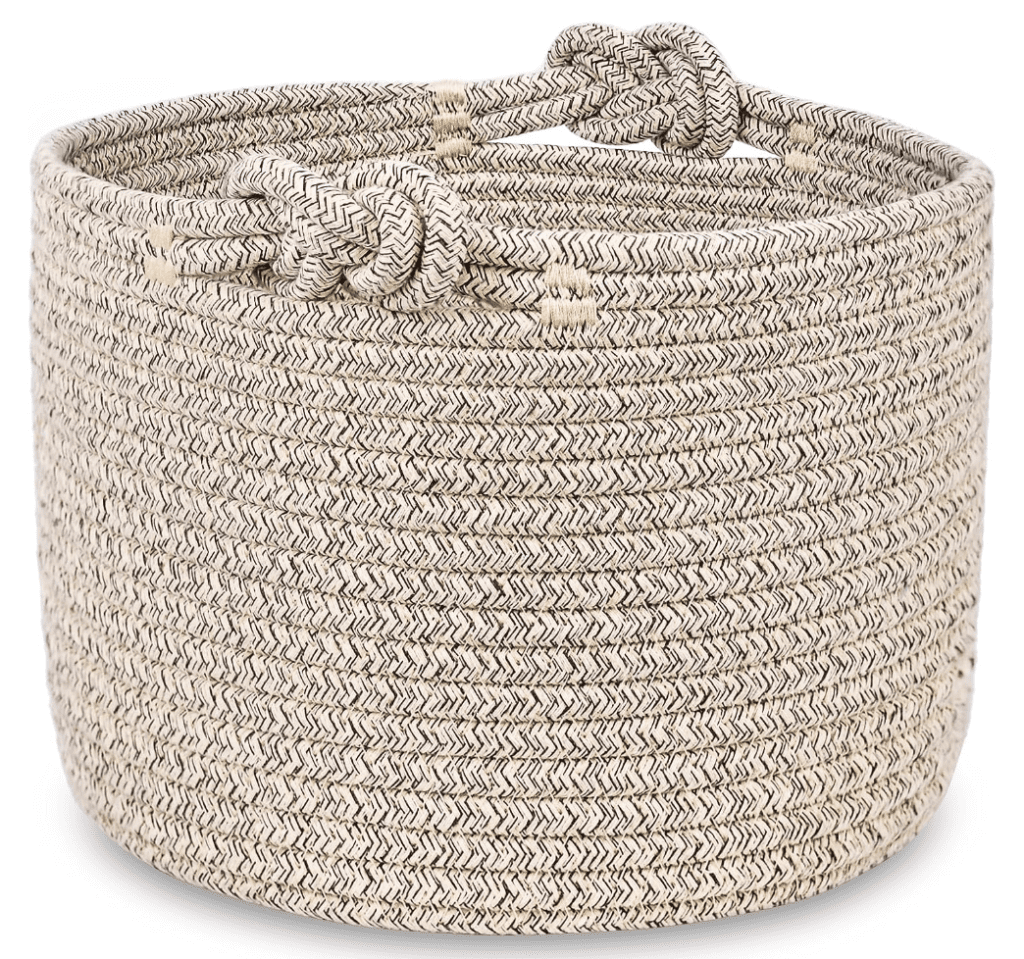 brown woven basket for blankets and pillows