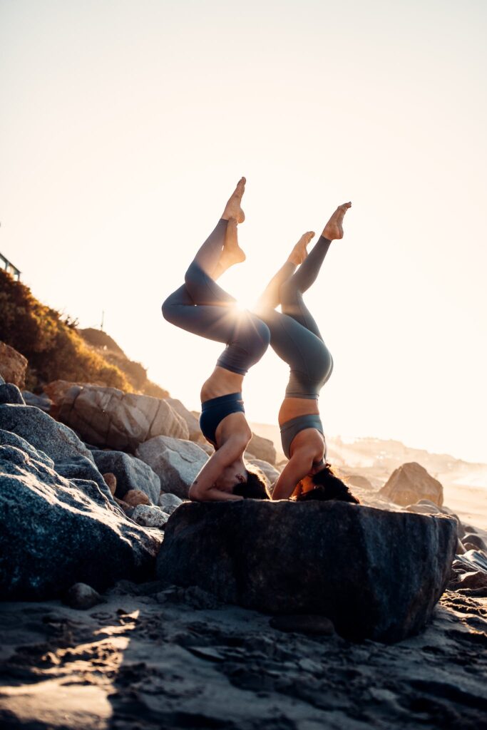 Women Doing Acro Yoga Together. Taking care of your body and mind are things to be proud of in your twenties.