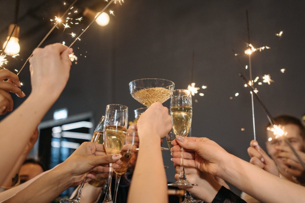 People Doing a Wine Toast while making new year resolutions