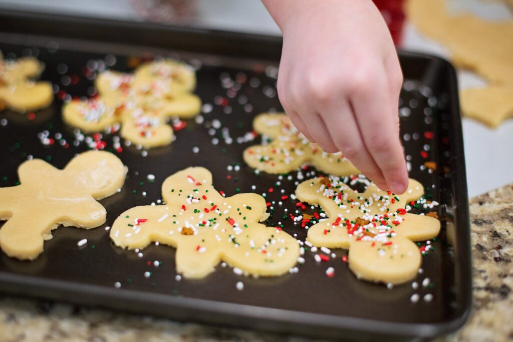 Person Baking Cookies on Tray. Try baking as one of many new hobbies this year